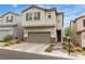 Attractive home featuring a two-car garage and easy-care desert landscaping for a welcoming curb appeal at 10836 Montana Blanca Ave, Las Vegas, NV 89166