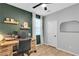 Cozy office space featuring a wood desk, rolling chair, and accent wall, offering a functional workspace at 10836 Montana Blanca Ave, Las Vegas, NV 89166