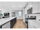 Well-lit kitchen boasts modern appliances, white cabinetry, and a spacious island at 10836 Montana Blanca Ave, Las Vegas, NV 89166