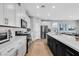 Modern kitchen with stainless steel appliances, center island with seating, and open layout for seamless entertaining at 10836 Montana Blanca Ave, Las Vegas, NV 89166