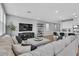 Spacious living room with neutral decor, hardwood floors, and recessed lighting at 10836 Montana Blanca Ave, Las Vegas, NV 89166