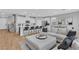 Open living space featuring a modern kitchen, cozy living room, and a dining area at 10836 Montana Blanca Ave, Las Vegas, NV 89166