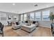 Bright, open living and dining area with modern furnishings and wood floors throughout at 10836 Montana Blanca Ave, Las Vegas, NV 89166