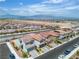Street view of neighborhood homes with picturesque mountain views and convenient highway access at 10836 Montana Blanca Ave, Las Vegas, NV 89166