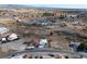Aerial view of community with property that has solar panels on white roof at 1261 S Comstock St, Pahrump, NV 89048
