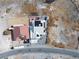 A closer aerial view of the property with solar panels on a bright white roof at 1261 S Comstock St, Pahrump, NV 89048