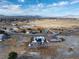 Aerial view of this house with solar panels in its community at 1261 S Comstock St, Pahrump, NV 89048