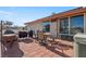 The brick back patio features outdoor seating, hot tub and a built-in barbeque at 1261 S Comstock St, Pahrump, NV 89048