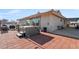 This backyard features a tiled patio and a relaxing hot tub at 1261 S Comstock St, Pahrump, NV 89048