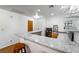Stylish bar area with granite countertops, storage, and seating for entertaining at 1261 S Comstock St, Pahrump, NV 89048
