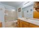 Bathroom featuring shower and tub combo, a large mirror, and good lighting at 1261 S Comstock St, Pahrump, NV 89048