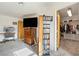 Bedroom featuring carpet flooring, a media cabinet, and a walk-in closet at 1261 S Comstock St, Pahrump, NV 89048