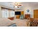 Bedroom featuring carpet flooring, a ceiling fan, and an ensuite bathroom at 1261 S Comstock St, Pahrump, NV 89048