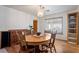 Dining room with hardwood flooring and ample lighting at 1261 S Comstock St, Pahrump, NV 89048