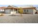 Exterior elevation showcasing gravel landscaping and roof at 1261 S Comstock St, Pahrump, NV 89048