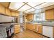 Traditional kitchen with wood cabinets, granite counters, a window, and plank flooring at 1261 S Comstock St, Pahrump, NV 89048