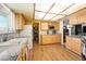 Kitchen with hardwood flooring, granite countertops and white appliances at 1261 S Comstock St, Pahrump, NV 89048