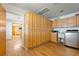 Large laundry room with storage cabinets, sink, and modern washer and dryer at 1261 S Comstock St, Pahrump, NV 89048