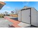 Side yard view of an exterior storage shed, perfect for tools at 1261 S Comstock St, Pahrump, NV 89048