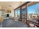 Sun room with large windows, ceiling fan, carpeting, and views of mountains at 1261 S Comstock St, Pahrump, NV 89048