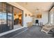 Sun room with large windows, ceiling fan, carpeting, and entrance into the house at 1261 S Comstock St, Pahrump, NV 89048