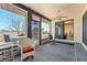 This sun room features large windows, brick trim, carpeting and views to the patio at 1261 S Comstock St, Pahrump, NV 89048