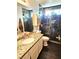 Bathroom featuring marble shower, granite countertops, and modern fixtures for a luxurious feel at 1482 Flintrock Rd, Henderson, NV 89014