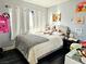 Bright bedroom with neutral decor, comfortable bed, and playful decorative touches throughout at 1482 Flintrock Rd, Henderson, NV 89014