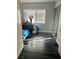 Bright bedroom with black wood flooring, a large window and a closet with sliding doors at 1482 Flintrock Rd, Henderson, NV 89014