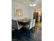 Elegant dining room with a large table, stylish seating, and chandelier lighting at 1482 Flintrock Rd, Henderson, NV 89014