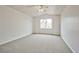 Bright bedroom with vaulted ceilings and view of palm trees at 1604 Tamborine Ct, Las Vegas, NV 89128