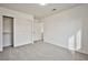 Carpeted bedroom offers neutral walls, double door closet and an entry to the rest of the house at 1604 Tamborine Ct, Las Vegas, NV 89128