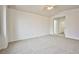 Neutral bedroom with ceiling fan, view, and access to other rooms at 1604 Tamborine Ct, Las Vegas, NV 89128