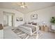 Serene main bedroom with plush carpeting, a neutral color scheme, and ample natural light for relaxation at 1604 Tamborine Ct, Las Vegas, NV 89128