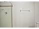 Shower featuring white tiles with a decorative border at 1604 Tamborine Ct, Las Vegas, NV 89128