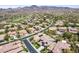 Stunning aerial view of a Primary-planned community with well-manicured lawns and desert landscaping at 17 Winding Rd, Henderson, NV 89052