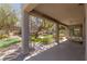 Covered patio overlooking a meticulously landscaped backyard with spiral staircase, manicured lawn, and putting green at 17 Winding Rd, Henderson, NV 89052