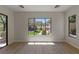 Light-filled bedroom with large windows offering serene backyard views, highlighting indoor-outdoor living at 17 Winding Rd, Henderson, NV 89052