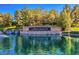 Scenic view of Anthem Country Club entrance with water feature and lush greenery around the monument sign at 17 Winding Rd, Henderson, NV 89052