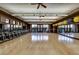 Large, bright gym with wood floor, spinning bikes, and exercise equipment in a fitness center at 17 Winding Rd, Henderson, NV 89052