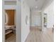Hallway view with a modern vanity, and fixtures visible through an open doorway and sleek design at 17 Winding Rd, Henderson, NV 89052