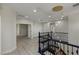 Spacious landing with modern lighting and black metal railings overlooking the entryway at 17 Winding Rd, Henderson, NV 89052
