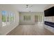 Bright living room with wood floors, shutters, and a sleek fireplace, creating a cozy ambiance at 17 Winding Rd, Henderson, NV 89052