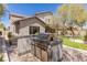 Outdoor kitchen complete with stainless steel grill and counter space at 17 Winding Rd, Henderson, NV 89052