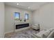 The sitting room has neutral colors and a modern fireplace at 17 Winding Rd, Henderson, NV 89052