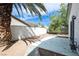 This home features a large backyard area with a large palm tree for added shade at 1878 Corvette St, Las Vegas, NV 89142