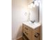 Modern bathroom vanity features a wood cabinet, white countertop, and sleek black fixtures at 1878 Corvette St, Las Vegas, NV 89142
