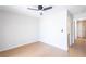 Minimalist bedroom with hardwood floors, a ceiling fan, and hallway access at 1878 Corvette St, Las Vegas, NV 89142