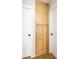 Hallway features a tall, light wood storage cabinet between two white doors at 1878 Corvette St, Las Vegas, NV 89142