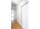Hallway with hardwood floors and white sliding closet doors at 1878 Corvette St, Las Vegas, NV 89142